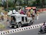 10-Jun-2001 13:56 - Agra - Agra Fort - Funeral procession on the road below the fort