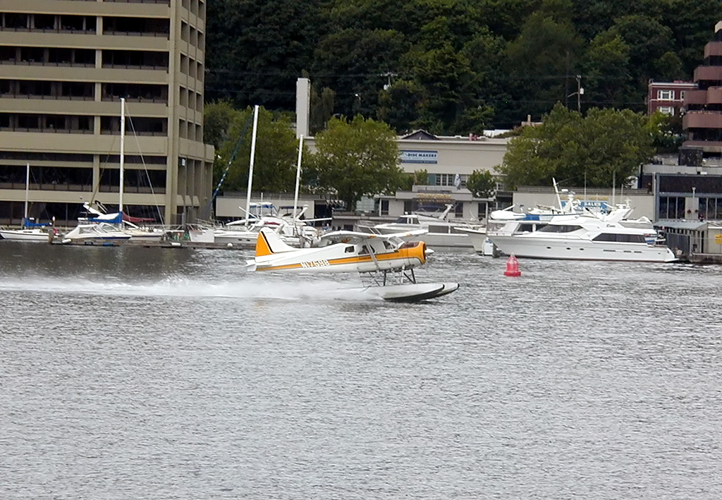 28-Jul-2000
Seattle - Lake Union
Flying boat taking off
Waiting to dock at the end of the ferry trip (there was another boat at the berth) it was fascinating to watch the coming and going of float planes. Kenmore AAir operates a pretty intensive service from Lake Washington. It is suprising that planes landing and taking off can co-exist with boats without mishap. 