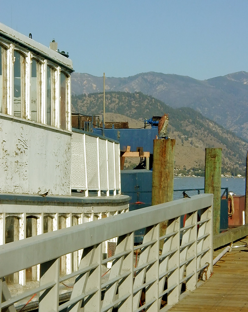 30-Jul-2000
Lake Chelan, WA
Lady of the Lake dock in Chelan
The bird on the post is a carving. The boat on the left is the original Lady of the Lake, moved to Lake Chelan in 1944 and retired in 1990.